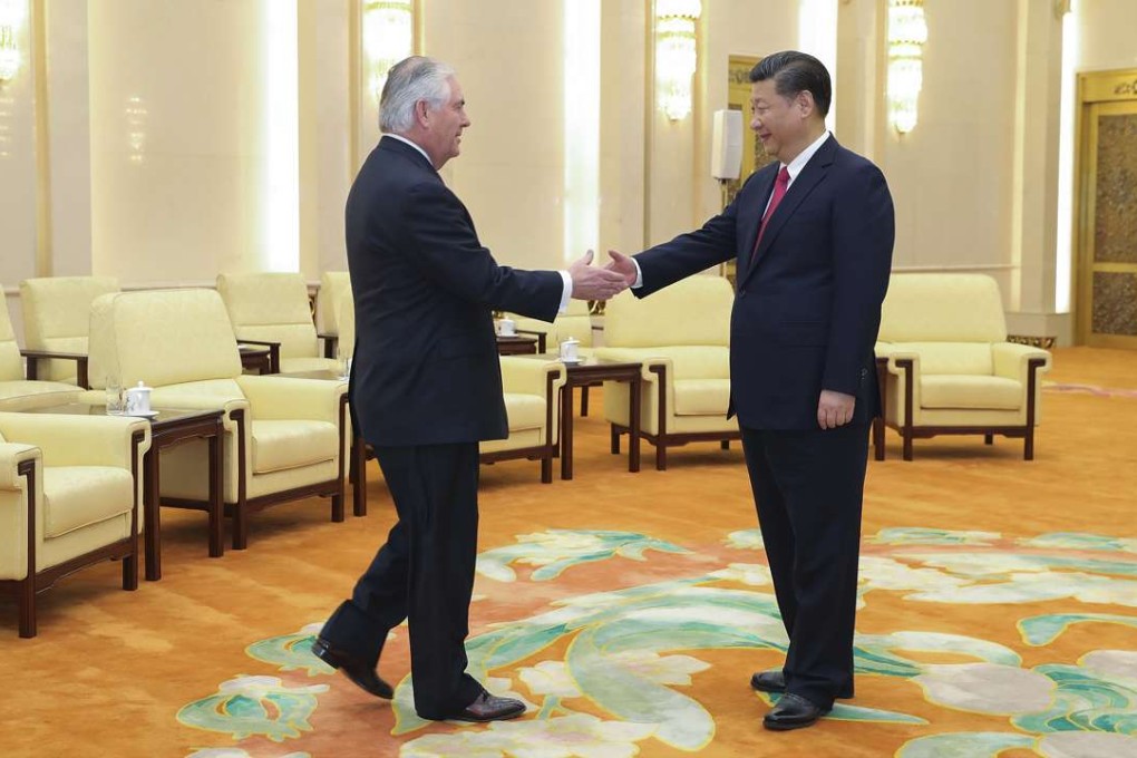 US State of Secretary Rex Tillerson, left, shakes hands with China's President Xi Jinping at the Great Hall of the People in Beijing on Sunday. The United States is looking forward to the first meeting between President Donald Trump and his Chinese counterpart, Tillerson said, on the final day of a swing through Asia dominated by concerns over North Korea's nuclear and missile programmes. Photo: AP