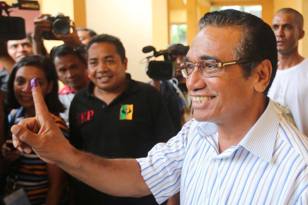 East Timor presidential candidate Francisco Guterres shows his ink marked finger after he casts his ballot. Photo: Reuters