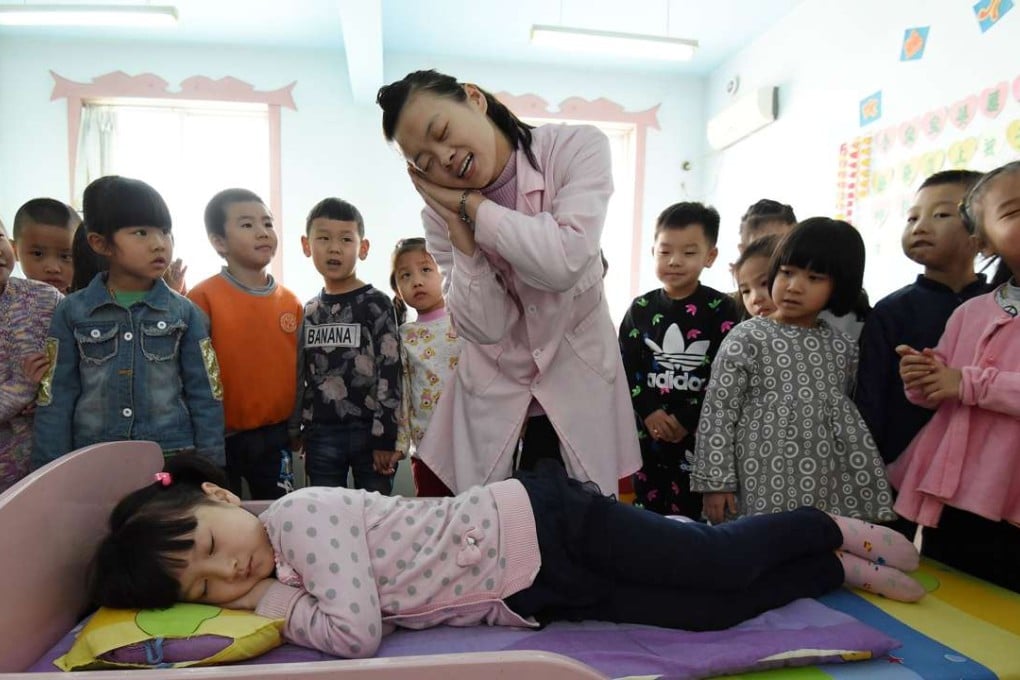 A doctor gives pupils at a kindergarten in Handan, Hebei Province, advice on healthy sleeping body positions on World Sleep Day last year. Photo: Xinhua