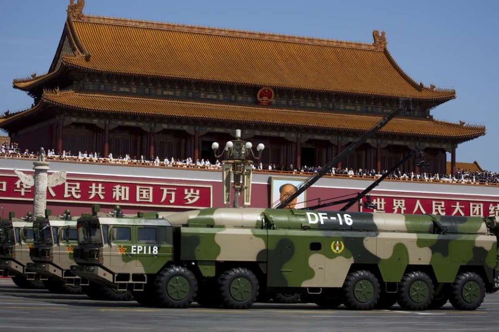 Military vehicles carry DF-16 ballistic missiles past Tiananmen Square during a military parade in Beijing two years ago. Photo: AP