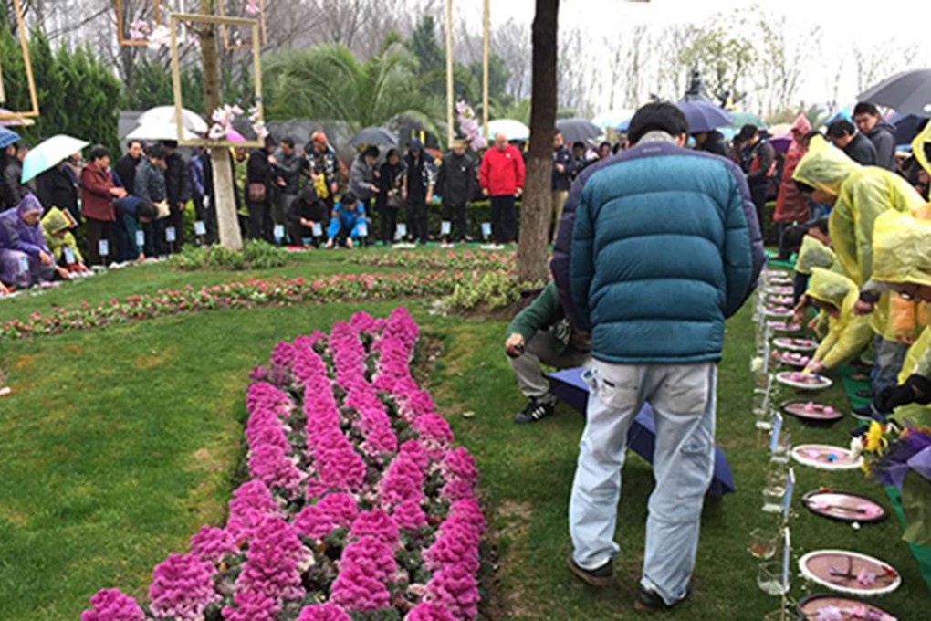 Chinese people tending the plots where the cremated remains of their loved ones are buried. Photo: Handout