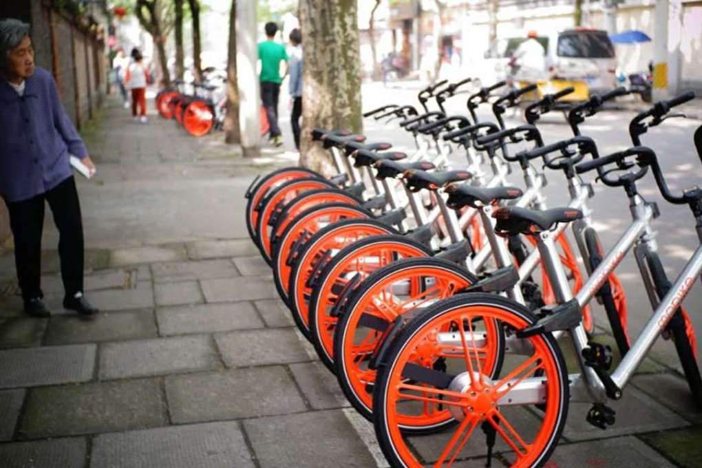 Mobikes parked on a street in Beijing. The company’s entry into Singapore is hot on the footsteps of rival Ofo. Photo: Handout