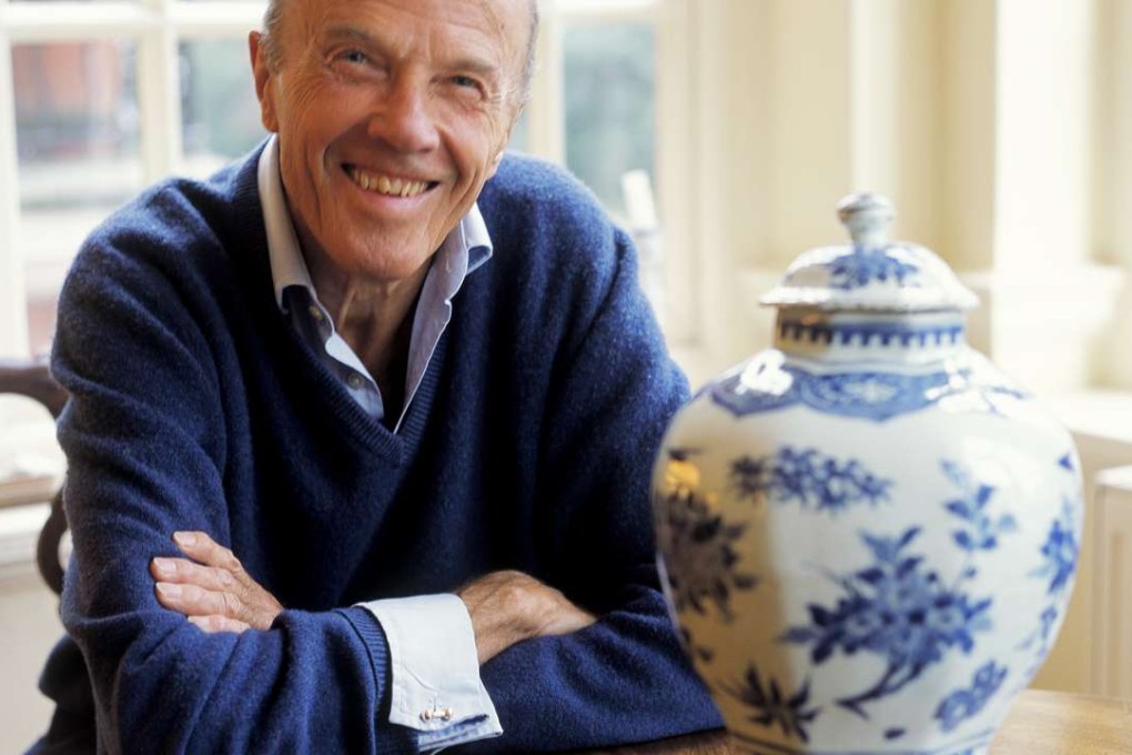 The late Sir Michael Butler with a 17th-century Chinese ceramic octagonal jar from his collection. Picture: courtesy of Katharine Butler