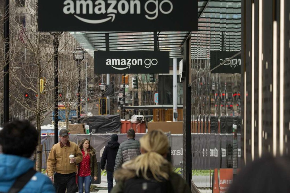 Pedestrians walk past the new Amazon.com Inc. Go grocery store in Seattle, Washington, as the giant retailer intensifies its battle against counterfeit goods. Photo: Bloomberg