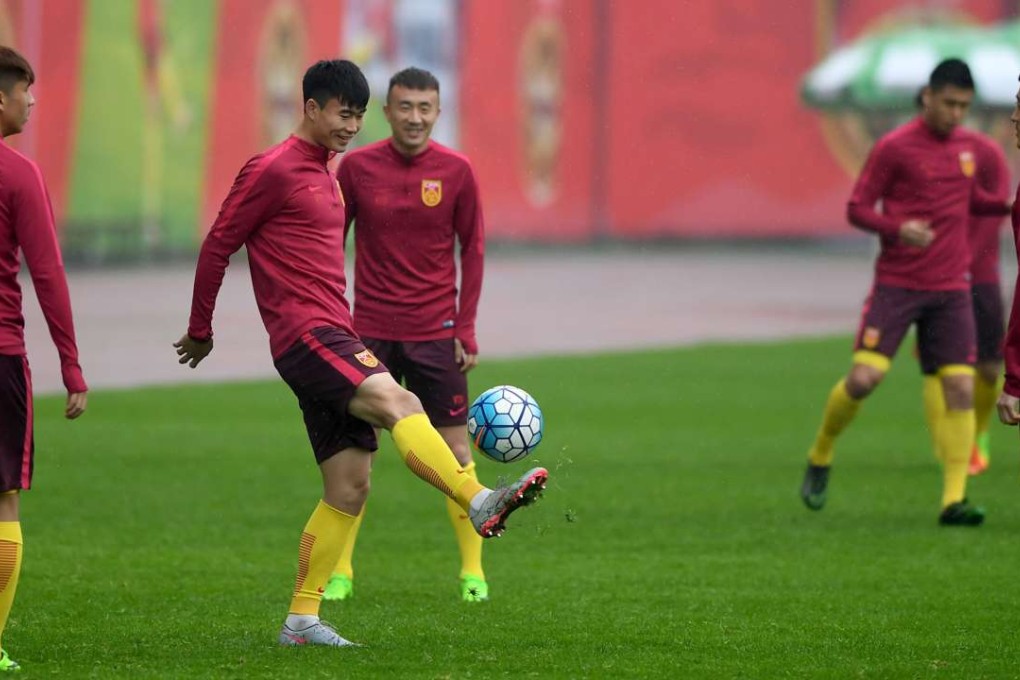 Members of China's national team take part in a training session for the upcoming World Cup qualifier football match against South Korea in Changsha. Photo: AFP