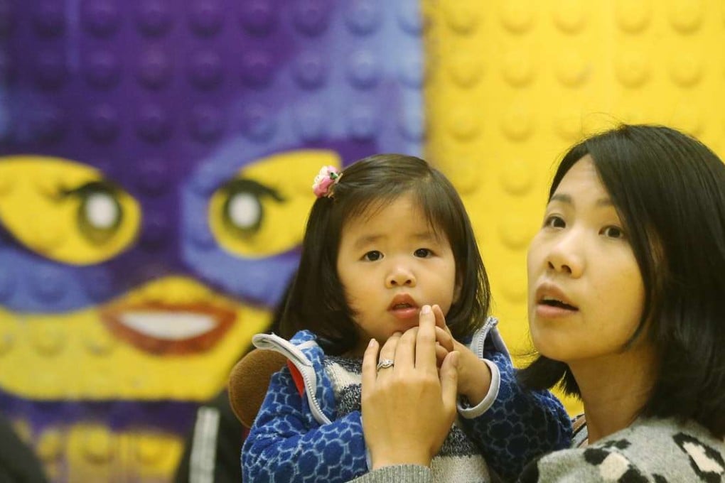 A mother and her daughter at a Lego Batman exhibition at Olympian City. Photo: David Wong