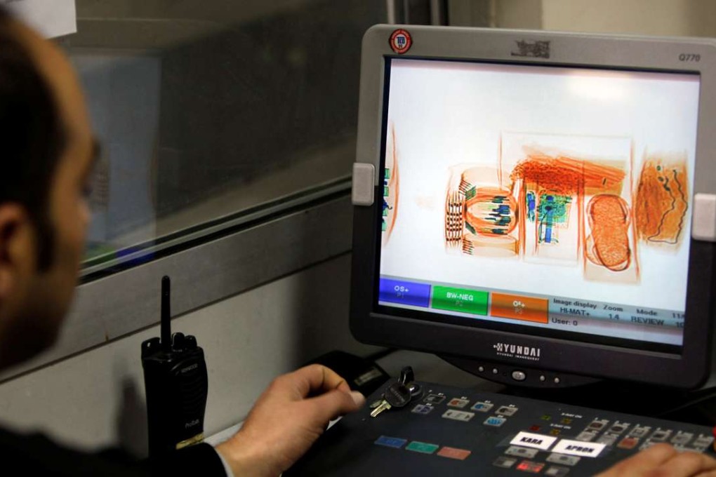 A security official looks at a screen displaying X-ray screened parcels in Turkish Post's (PTT) postal logistic centre at the Ataturk International airport in Istanbul, Turkey. Photo: Reuters