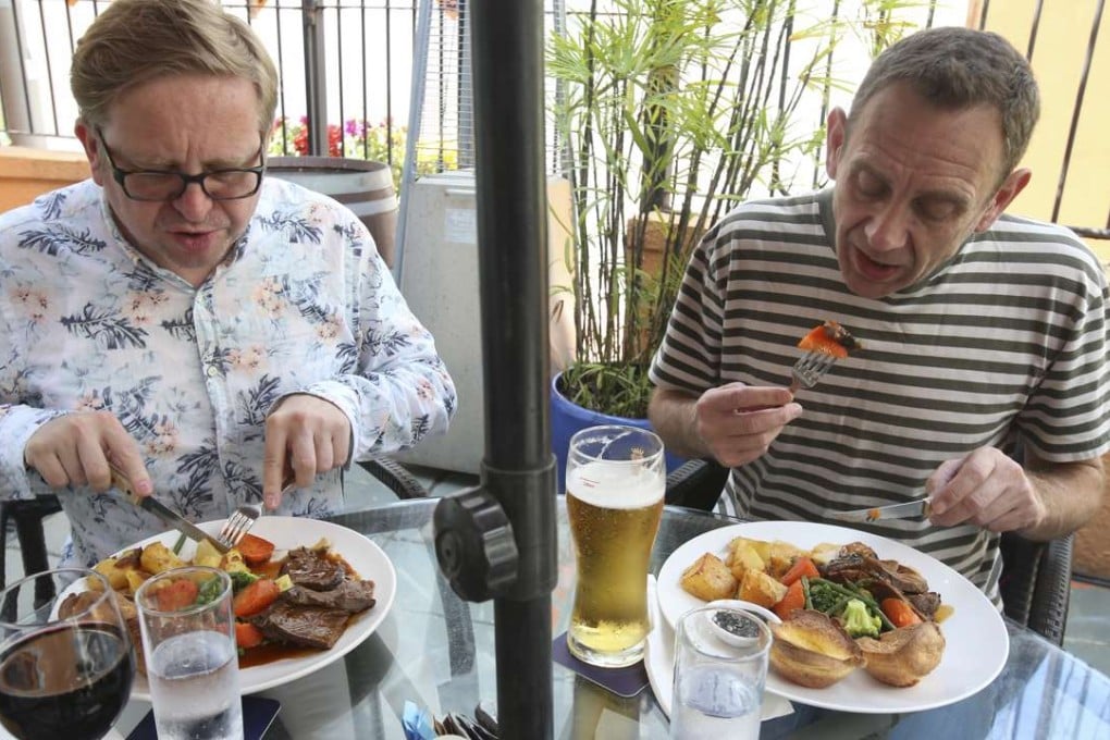 The Post’s Kevin McCardle (left) tucks into roast beef, while Mark Sharp samples the roast lamb at Steamers in Sai Kung. Photo: David Wong