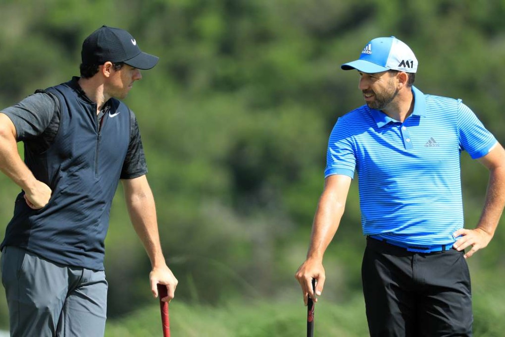 Rory McIlroy and Sergio Garcia chat during the first day of play at the WGC Dell Match Play at Austin Country Club in Austin, Texas. Photo: AFP