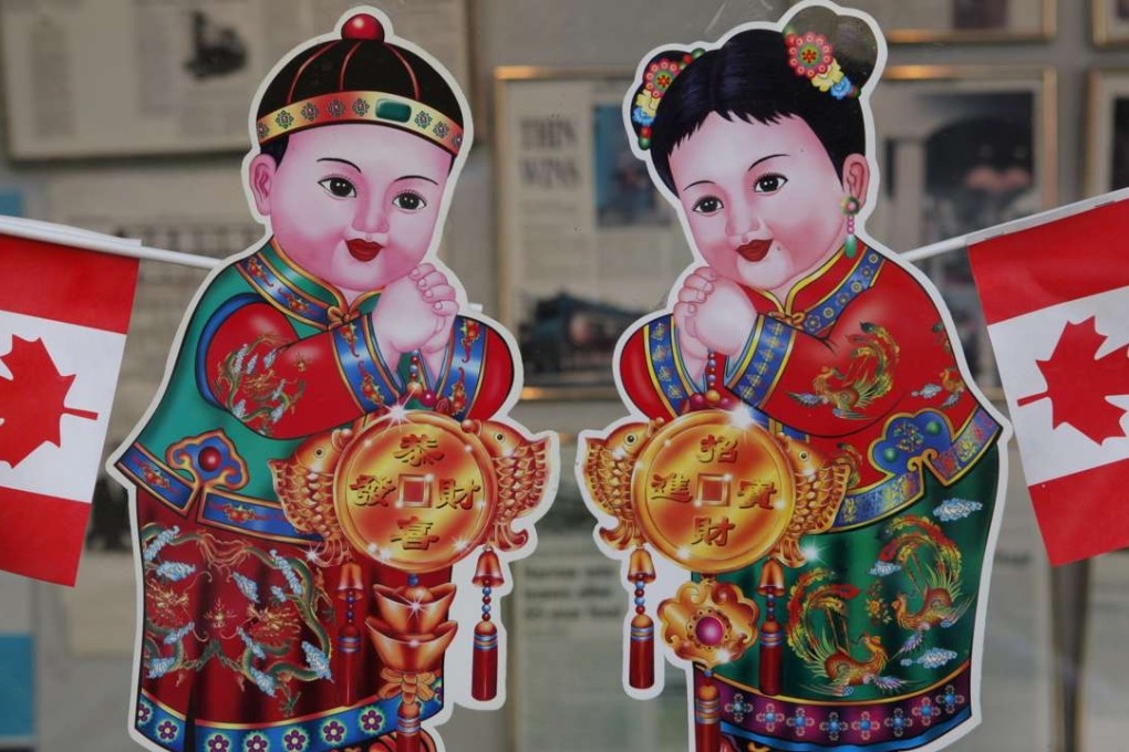 An entrance to a commercial building is adorned with Canadian flags and Chinese characters in Chinatown in Vancouver. Photo: AP