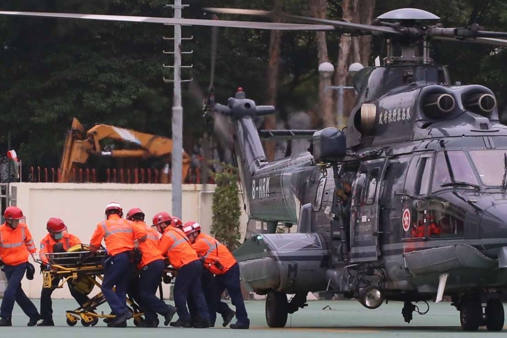 Principal fireman Yau Siu-ming is rushed to Prince of Wales Hospital after being airlifted to a Sha Tin fire station. Photo: Handout