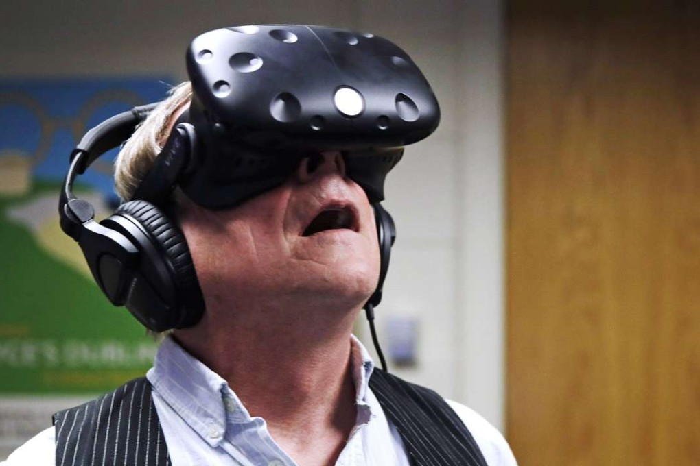 Boston College English professor Joseph Nugent is immersed in virtual reality, the medium for his class’ ambitious assignment to bring literature to life. Photo: AP
