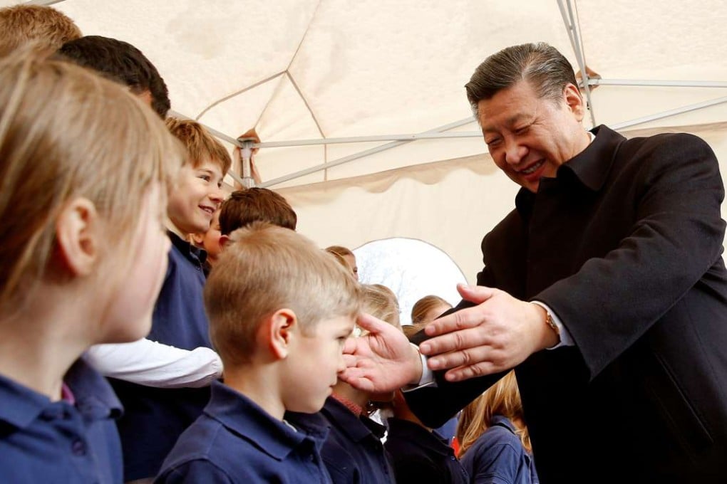 Chinese President Xi Jinping thanks members of a children's choir after their performance at a train station in Kehrsatz, Switzerland. Photo: Reuters