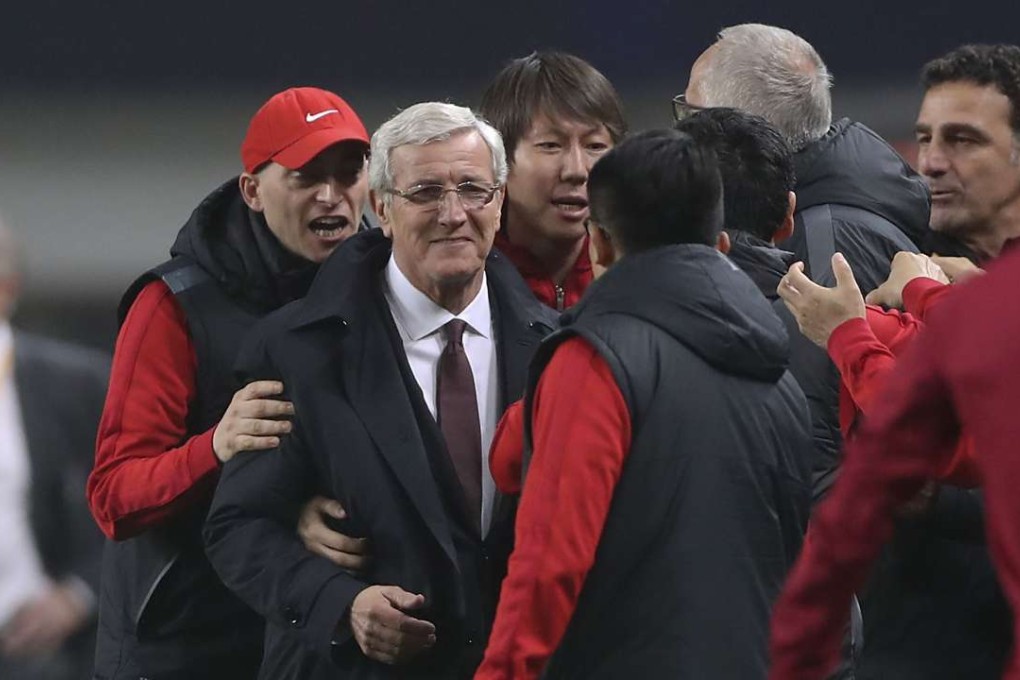 China coach Marcello Lippi celebrates the win over South Korea. Photo: Xinhua