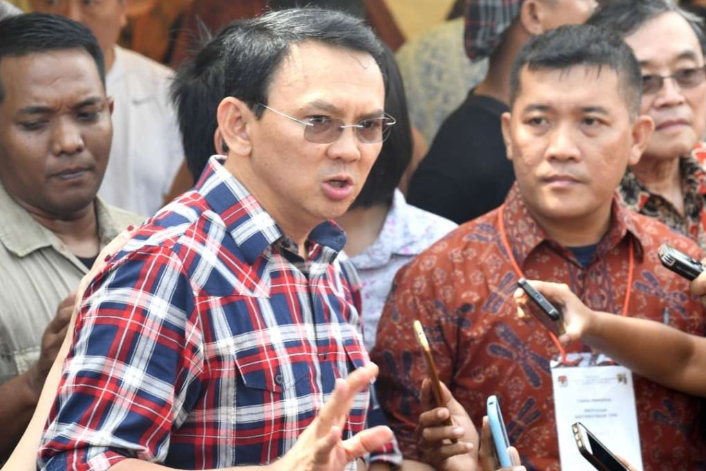 Jakarta's Christian governor Basuki Tjahaja Purnama talks to the media after he casts his vote in Jakarta on February 15. Purnama was put on trial for blasphemy after a doctored video of a speech went viral online. Photo: AFP