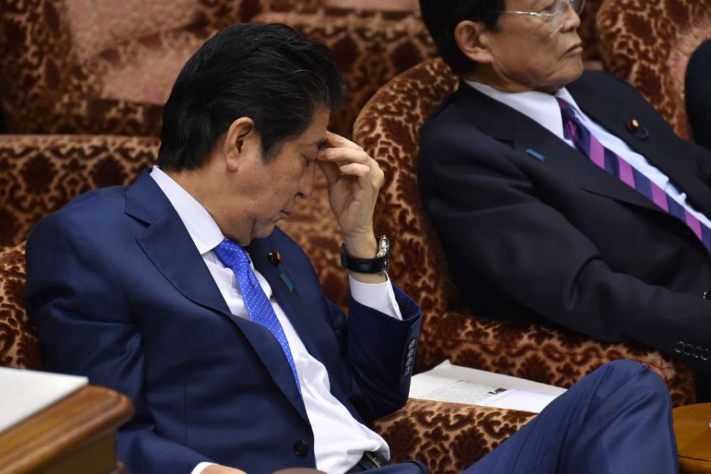 Japanese Prime Minister Shinzo Abe is under mounting pressure to explain his role in the scandal surrounding the Moritomo Gakuen school. Photo: AFP