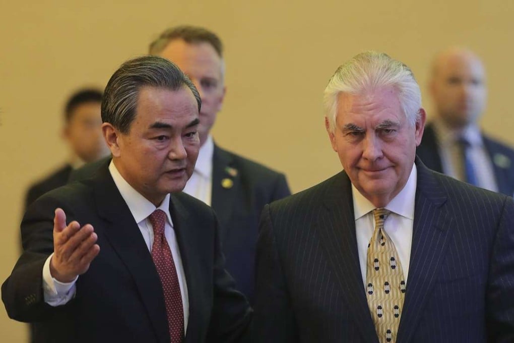 Foreign Minister Wang Yi and visiting US Secretary of State Rex Tillerson arrive for a joint press conference in Beijing on March 18. Wang urged the US to be “cool-headed” over North Korea after Tillerson said tensions were at “dangerous levels” over Pyongyang’s nuclear programme. Photo: Reuters