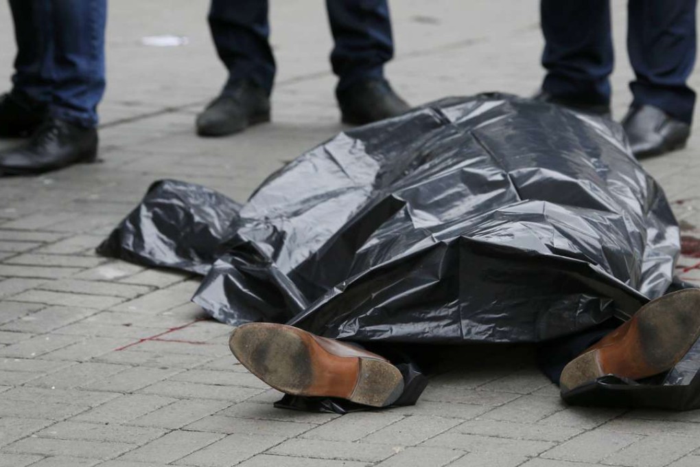 The body of Denis Voronenkov, a former lawmaker of the Russian State Duma, is seen in central Kiev, Ukraine, on Thursday, after his street assassination. Photo: Reuters