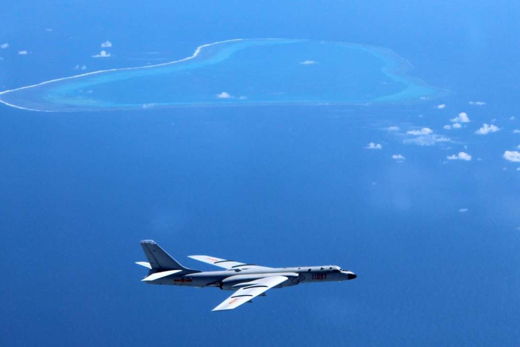 A Chinese H-6K bomber on patrol over islands and reefs including Scarborough Shoal, which it calls Huangyan Dao. Photo: Xinhua