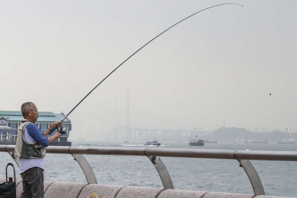 A man fishing in the Central angling zone. Photo: David Wong