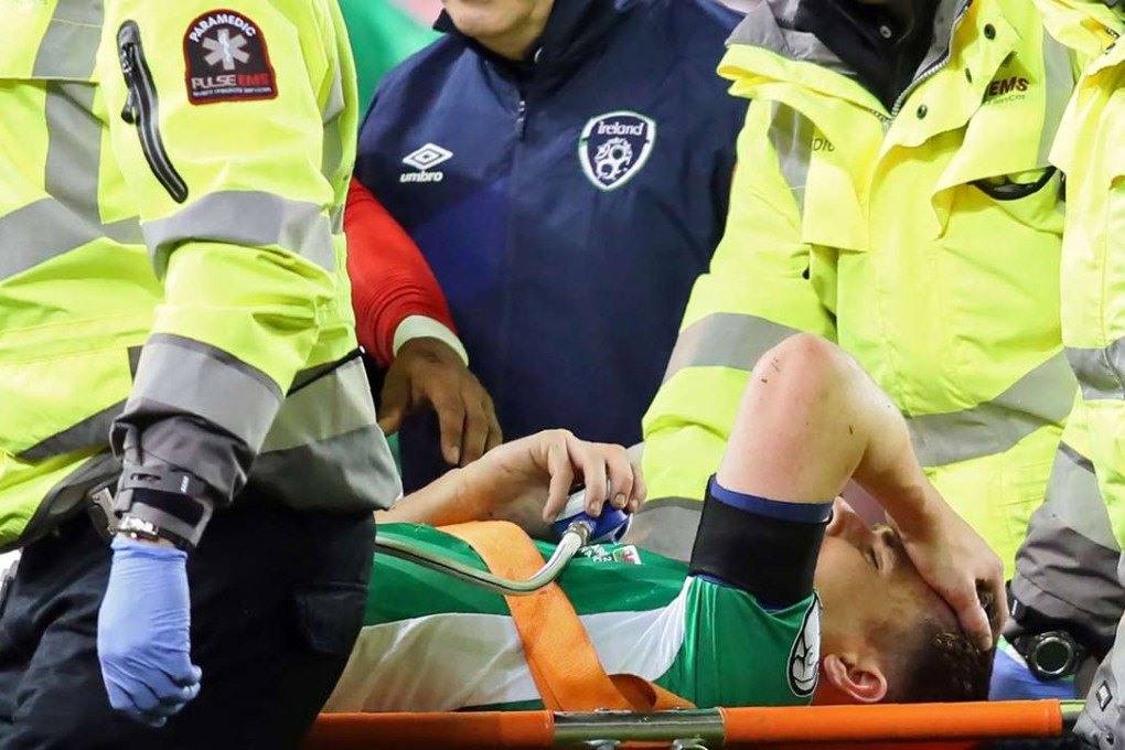 Republic of Ireland's defender Seamus Coleman is taken from the pitch on a stretcher. Photo: AFP