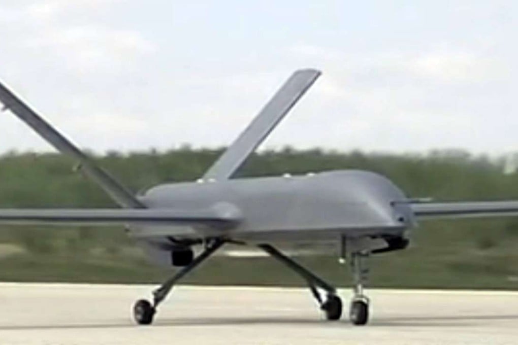 A Chinese CH-4 drone touches down at an undisclosed location after a test flight in August 2014. Photo: CCTV