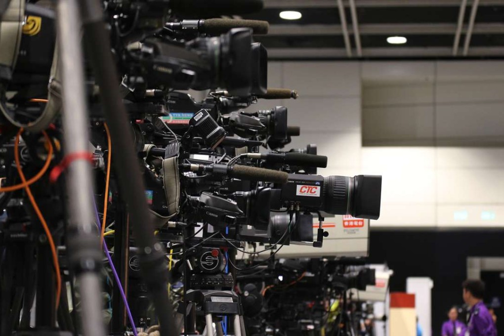 Cameras are fixed on Carrie Lam at the Convention and Exhibition Centre in Wan Chai after she is declared the winner of the chief executive election. Photo: Felix Wong