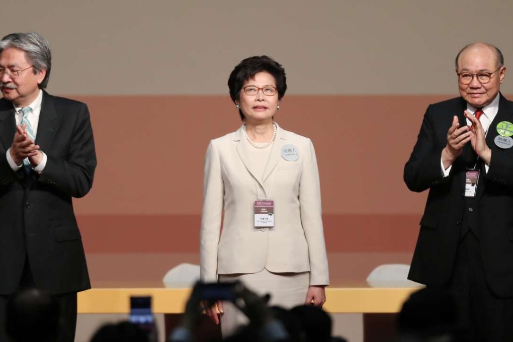 Carrie Lam is applauded by her defeated rivals, John Tsang (left) and Woo Kwok-hing. Photo: Robert Ng
