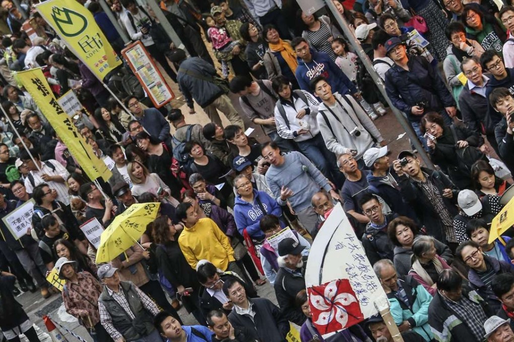 About 1,000 people march from Causeway Bay to Wan Chai in protest against the small-circle chief executive election. Photo: David Wong