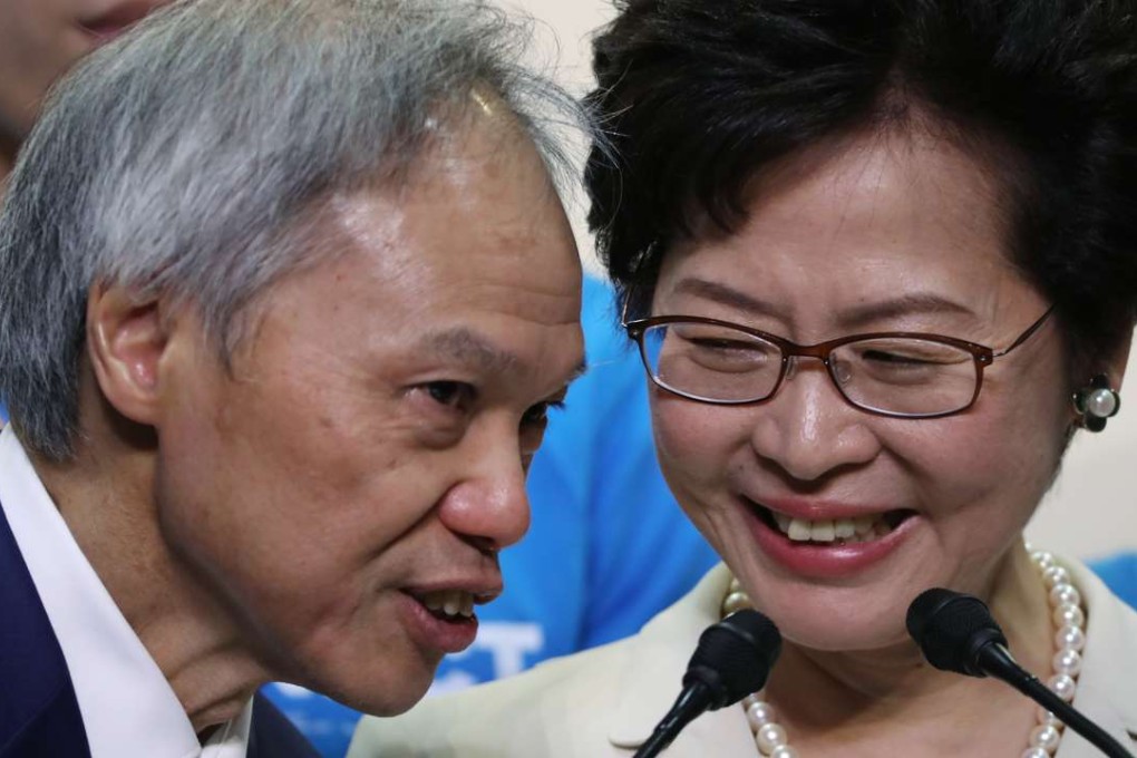 Carrie Lam, with her husband Lam Siu-por, after her chief executive election win at the Hong Kong Convention and Exhibition Centre. Photo: Robert Ng