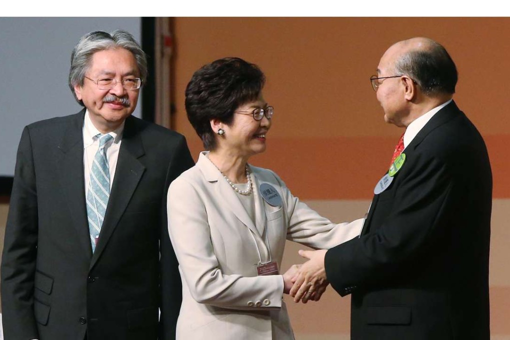 Chief Executive Election candidates John Tsang, Carrie Lam and Woo Kwok-hing stand on stage during the announcement of the results of the Hong Kong Chief Executive Election. Photo: David Wong