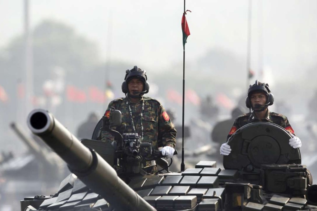 Myanmar military armed-tanks are driven during a parade to commemorate the Myanmar's 72nd Armed Forces Day. Photo: AP