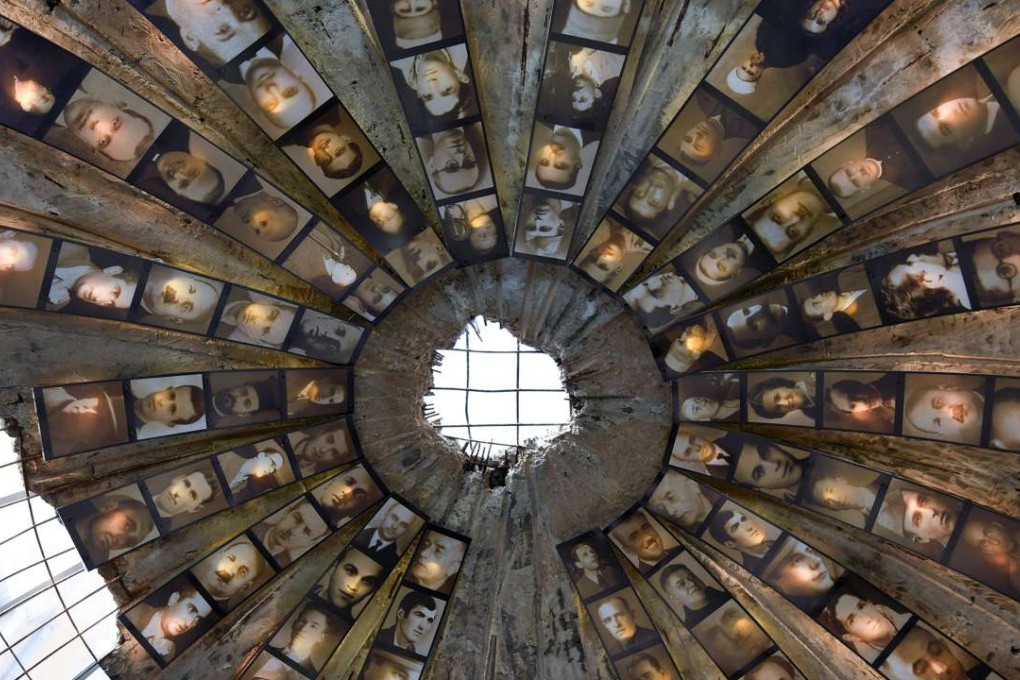 The entrance of a secret tunnel turned into a museum covered with photographs illustrating the political persecution of some 100,000 Albanians from 1945 until 1991 during the communist regime. More than a quarter of a century after toppling one of the harshest communist regimes in the world, Albania has decided to open to the public the files of the infamous intelligence service Sigurimi. Photo: AFP