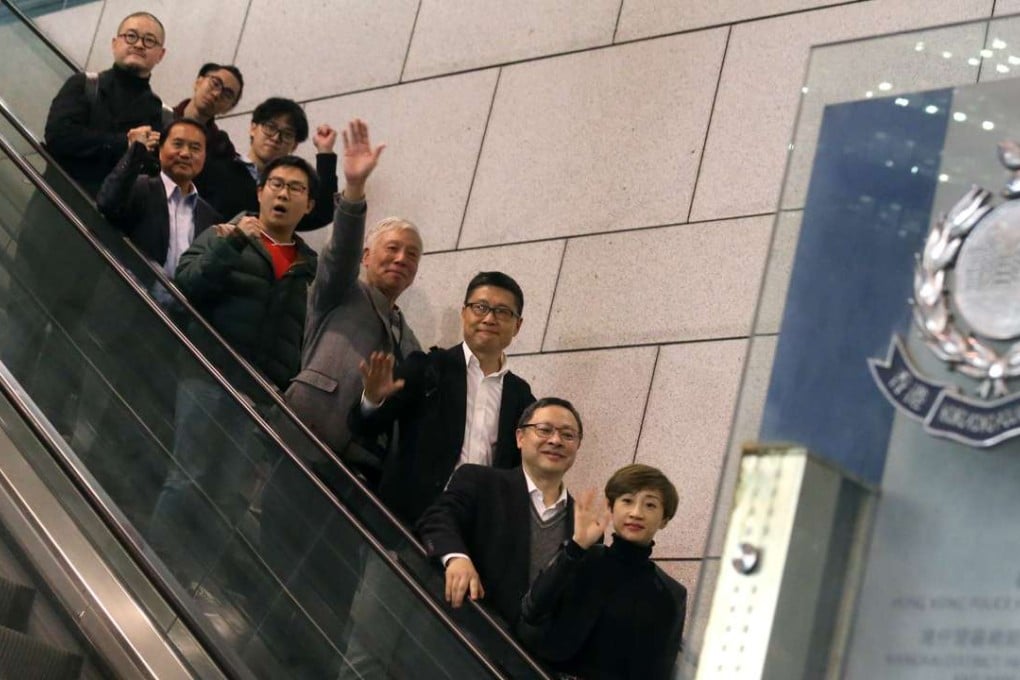 The nine who were charged over the Occupy protest leaving the Wan Chai police headquarters. Photo: K. Y. Cheng