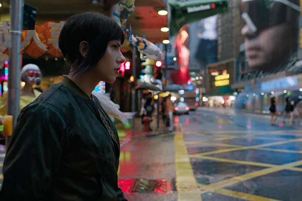 Scarlett Johansson on a Hong Kong street in a scene from the live-action film Ghost in the Shell, in which she plays the protagonist Major. Photo: Paramount Pictures