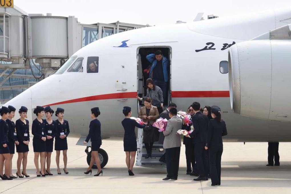 Passengers taking the new service from Dandong are welcomed at Pyongyang’s International Airport. Photo: Xinhua