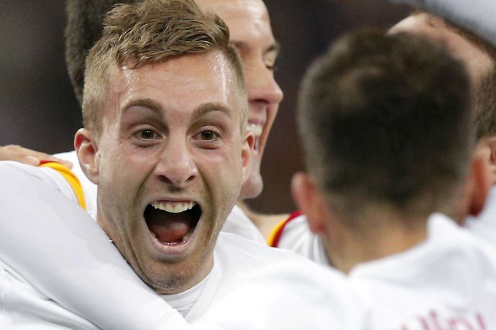 Spain’s Gerard Deulofeu is mobbed by his teammates after scoring the second goal against France in their friendly. Photo: AP