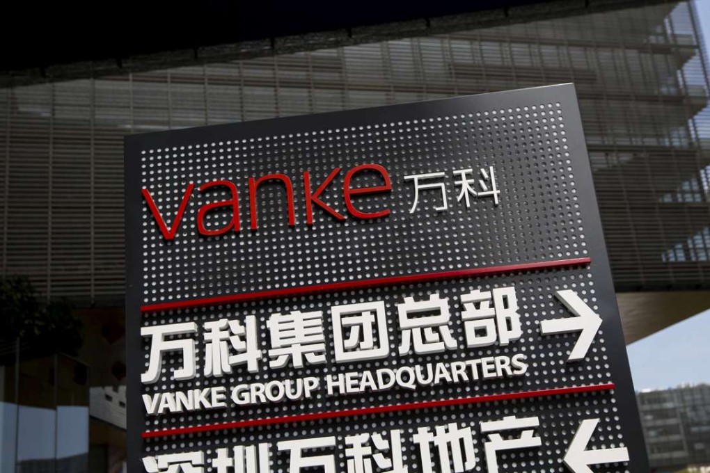 Signs show the direction of Vanke group headquarters and Shenzhen Vanke Real Estate at its headquarters in Shenzhen. Photo: Reuters