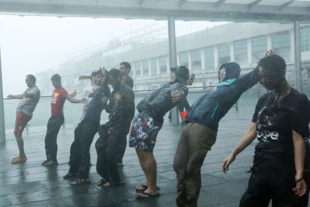 People brave powerful winds as Typhoon Haima hits Hong Kong in 2016. File photo: Edmond So