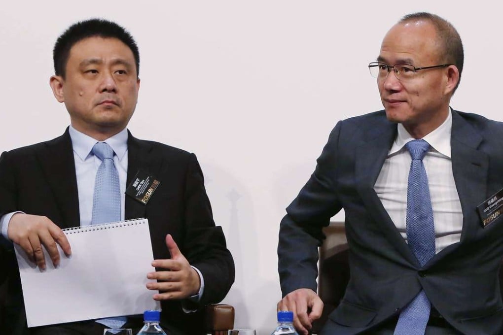 Chairman of Fosun Healthcare Chen Qiyu (left) and Fosun chairman Guo Guangchang at the group’s 2016 results announcement on Wednesday. Photo: Jonathan Wong