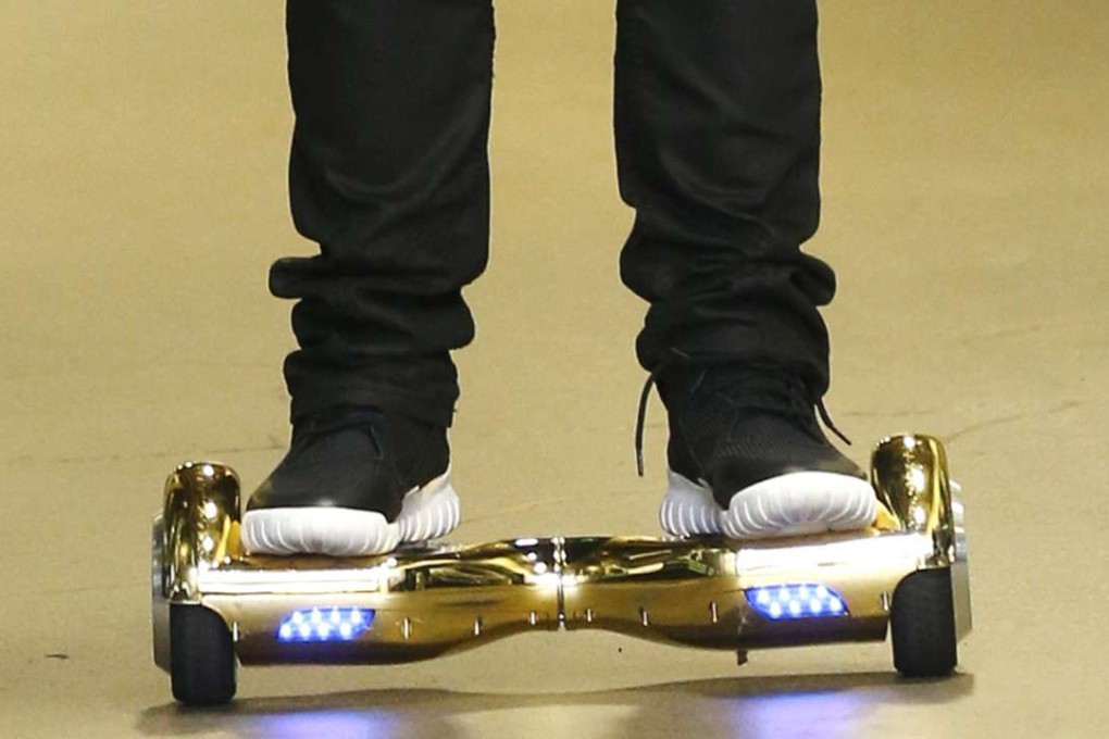 Seattle Seahawks wide receiver B.J. Daniels rides a hoverboard as he arrives for an NFL football game against the Carolina Panthers in 2015. Photo: AP