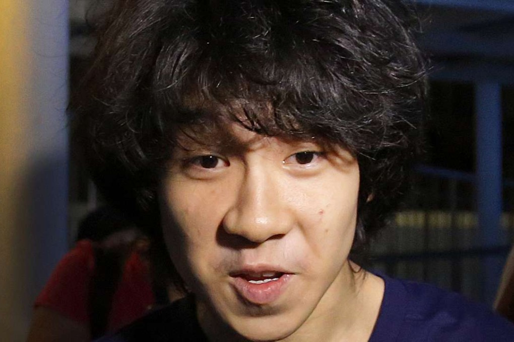 Singapore teen blogger Amos Yee speaks to a reporter while leaving the Subordinate Courts after being released on bail, in Singapore. Yee whose online posts blasting his government landed him in jail, was granted asylum to remain in the United States, but has not been freed. Photo: AP