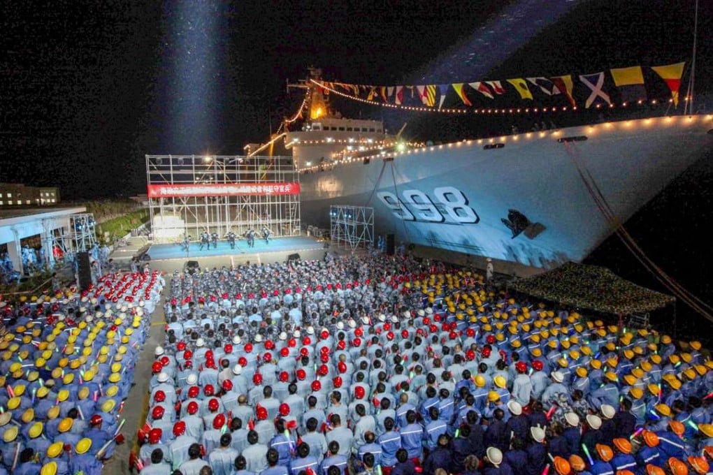 A file picture of one China’s previous-generation amphibious vessels, the Kunlun Shan, after it docked in Fiery Cross Reef in the disputed Spratly Islands in the South China Sea last year for a concert given to military personnel and workers. Photo: China News Service