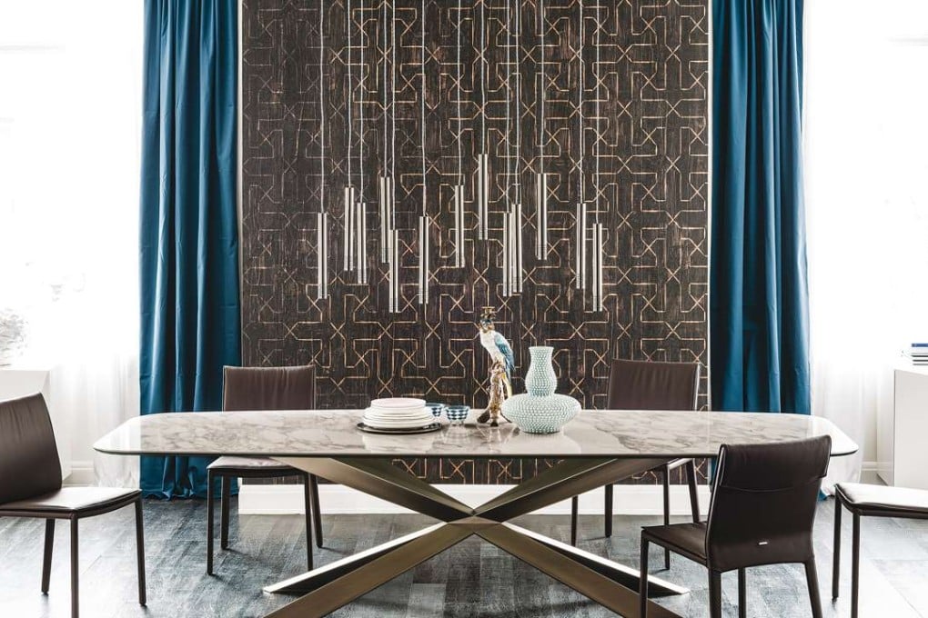 The Spyder table with ceramic top and wooden legs is available at Catellan Italian