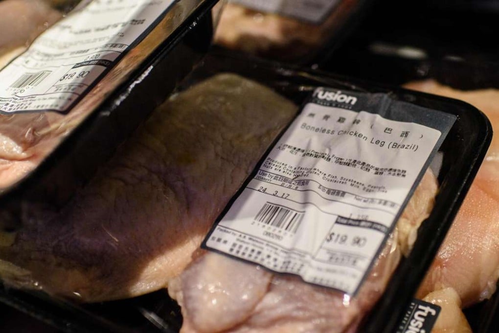 Packs of previously frozen chicken legs from Brasil stacked on a trolley shortly after a staff member cleared them from the shelves of a supermarket in Hong Kong. Photo: AFP