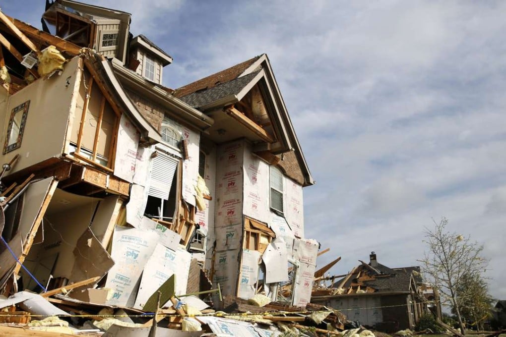 A house is damaged following a storm early in the morning in Rockwall, Texas on Wednesday, March 29, 2017. A powerful storm system with winds exceeding 60 mph has damaged homes in suburban Dallas, knocked out power to tens of thousands across Texas and brought heavy rain that inundated some areas. Photo: The Dallas Morning News via AP