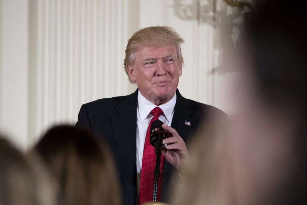 President Donald Trump pauses while speaking in the East Room of the White House in Washington. Photo: AP