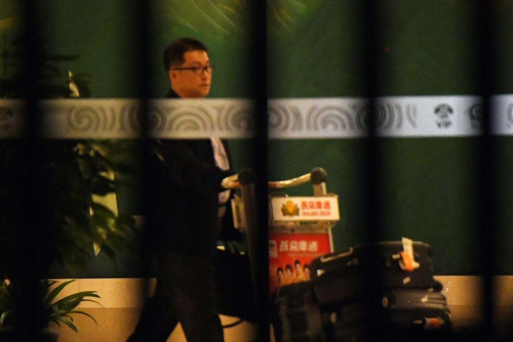 A North Korean official passes the VIP entrance at Beijing airport after arriving from Malaysia early onFriday. Photo: AFP