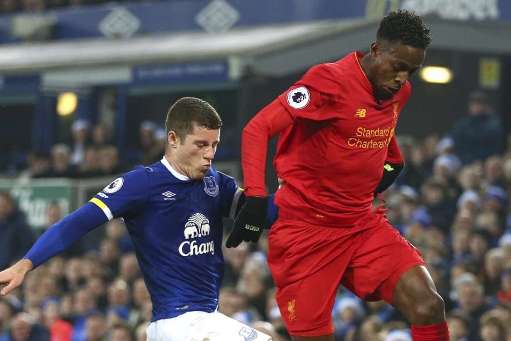 Liverpool's Divock Origi (right) and Everton's Ross Barkley at Anfield in December. Photo: AP