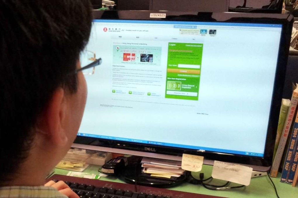 A person uses internet banking inside his office. Across Asia the trend in digital-only banking is on the rise. Photo: Handout